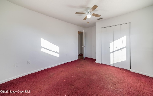 unfurnished bedroom with ceiling fan, carpet, and a closet