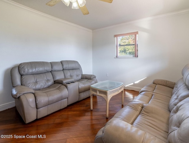 living room featuring dark wood-type flooring, crown molding, and ceiling fan