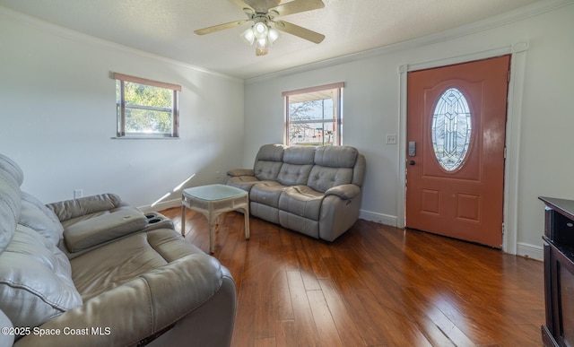 living room featuring ceiling fan, dark hardwood / wood-style floors, and crown molding