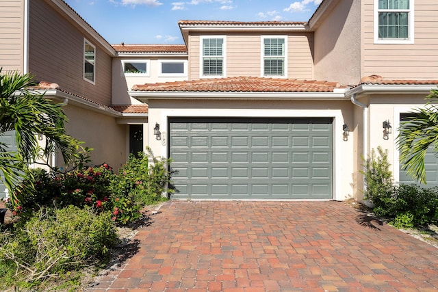 mediterranean / spanish-style home featuring a garage