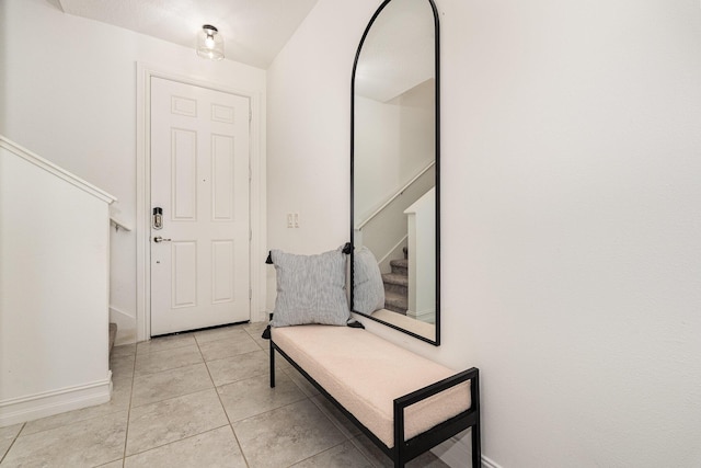 foyer entrance featuring light tile patterned floors