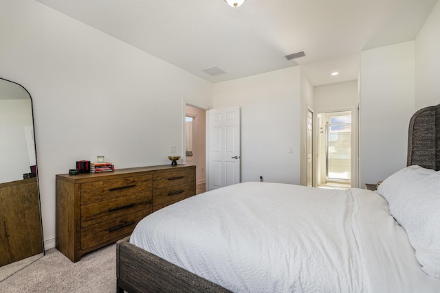 carpeted bedroom featuring ensuite bathroom