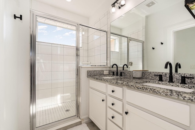 bathroom featuring vanity and walk in shower