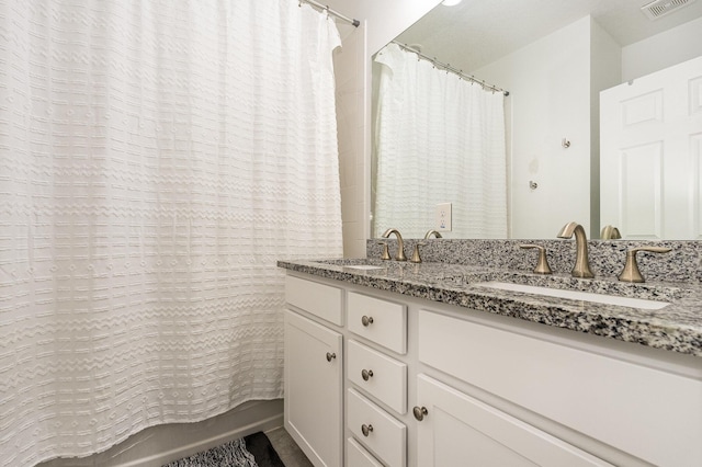 bathroom with vanity and shower / tub combo with curtain