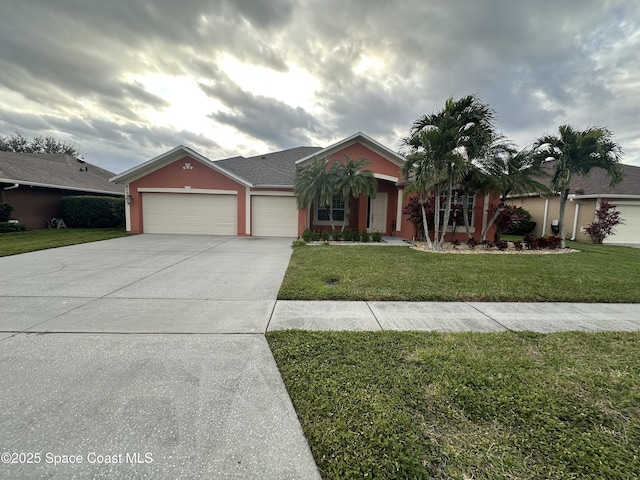 single story home with a front lawn and a garage