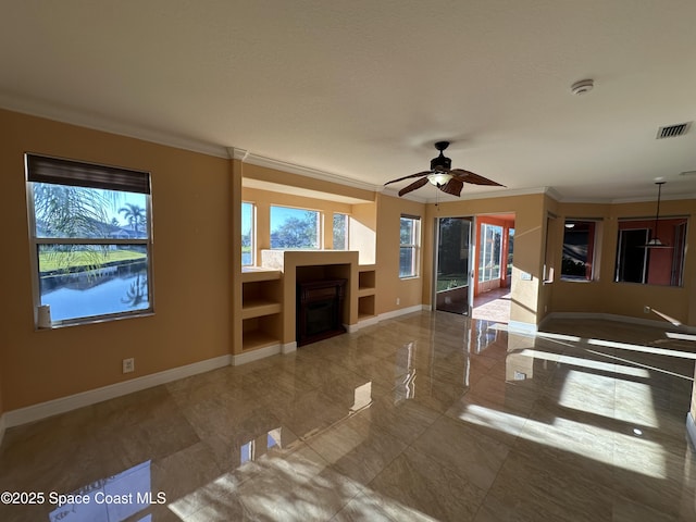 unfurnished living room with ceiling fan and ornamental molding