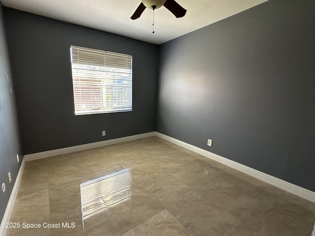 unfurnished room featuring ceiling fan