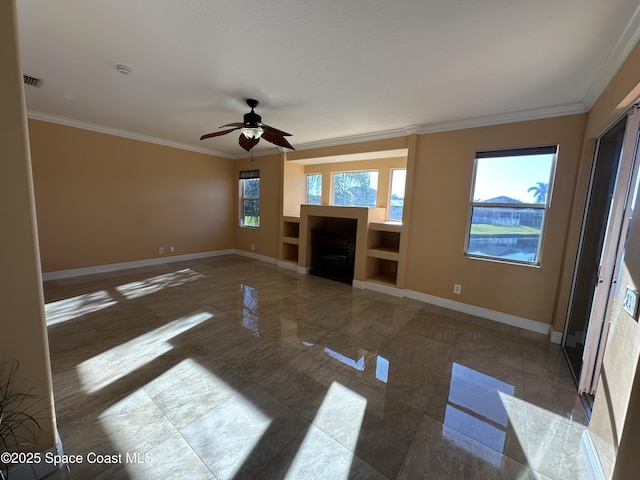 unfurnished living room featuring ceiling fan and ornamental molding