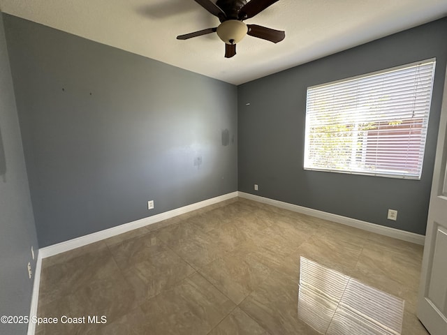 unfurnished room with ceiling fan