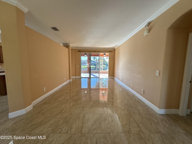 unfurnished room featuring ornamental molding