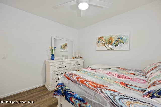 bedroom featuring ceiling fan and dark hardwood / wood-style flooring