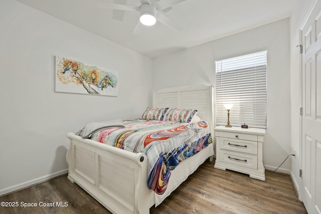 bedroom with ceiling fan and dark hardwood / wood-style flooring