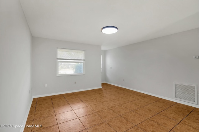 spare room featuring tile patterned floors