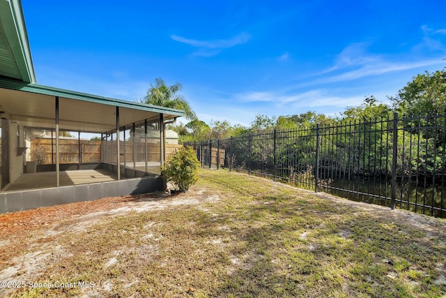 view of yard featuring a sunroom