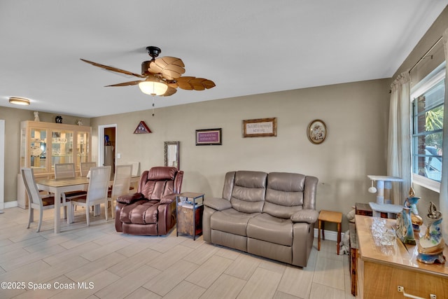 living room featuring ceiling fan