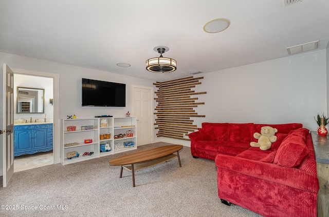 carpeted living room featuring sink