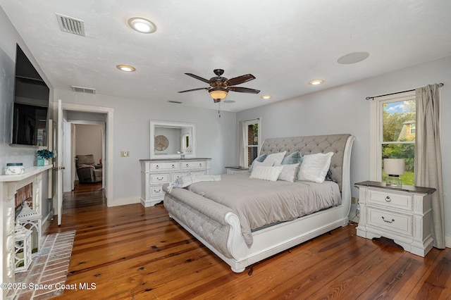 bedroom with ceiling fan and dark hardwood / wood-style flooring