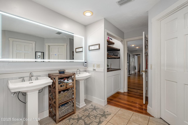 bathroom with tile patterned flooring and sink