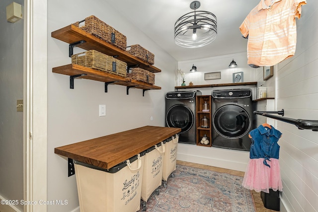 laundry area featuring washing machine and clothes dryer