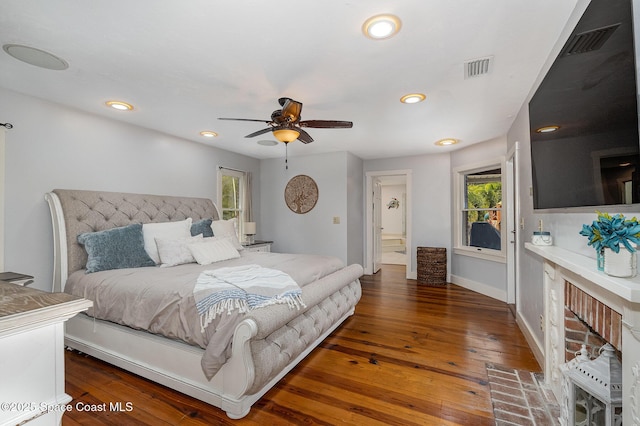 bedroom featuring multiple windows, ceiling fan, and dark hardwood / wood-style floors