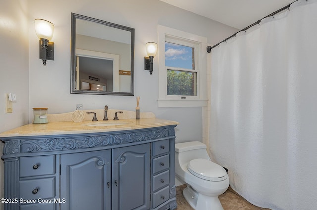 bathroom with tile patterned floors, vanity, and toilet