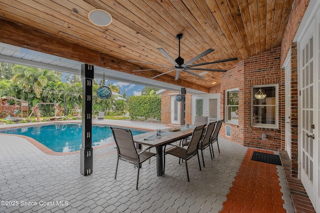 view of pool featuring a patio area and french doors