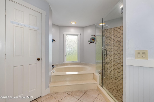 bathroom with tile patterned floors and plus walk in shower