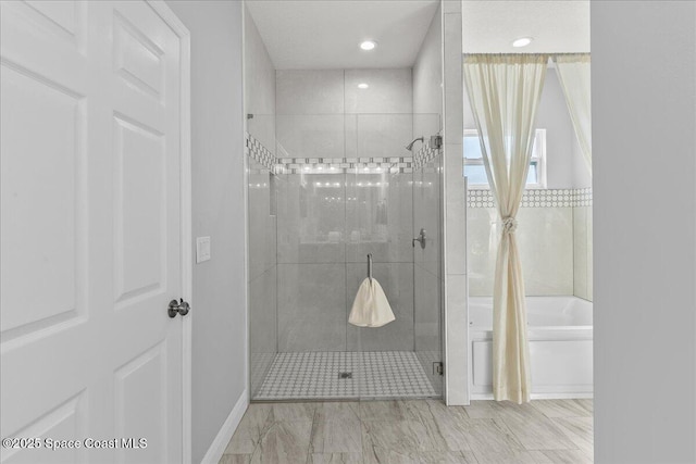 bathroom with independent shower and bath