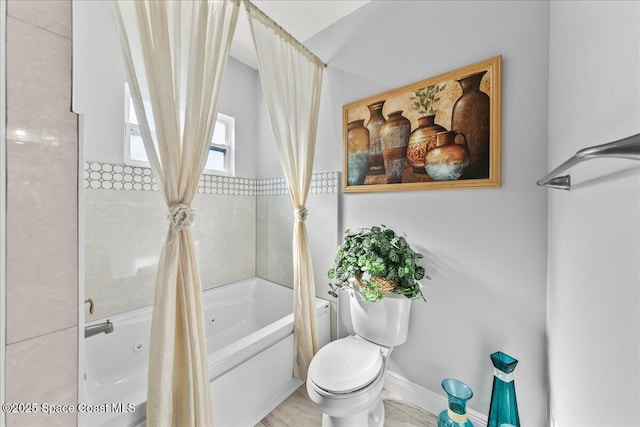 bathroom featuring toilet and shower / bath combo with shower curtain