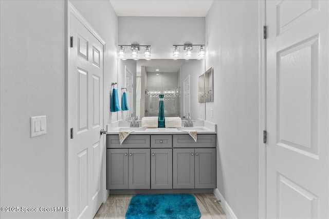 bathroom with vanity and an enclosed shower