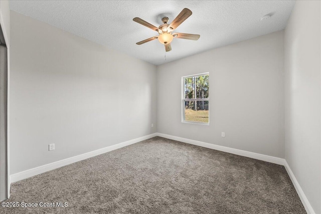 spare room featuring ceiling fan, carpet, and a textured ceiling