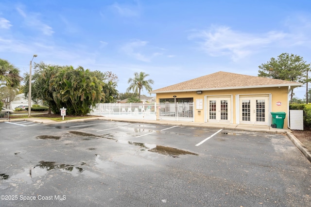 view of parking / parking lot featuring french doors