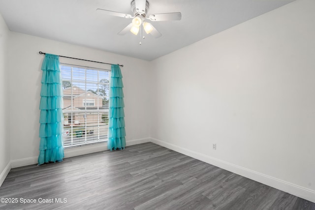 spare room featuring hardwood / wood-style floors and ceiling fan