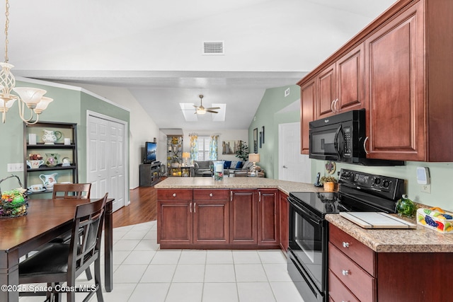 kitchen featuring black appliances, ceiling fan with notable chandelier, lofted ceiling, and kitchen peninsula