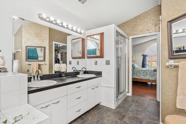 bathroom featuring vanity and a textured ceiling