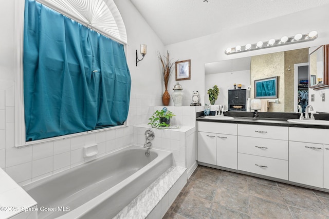 bathroom with vanity and a textured ceiling