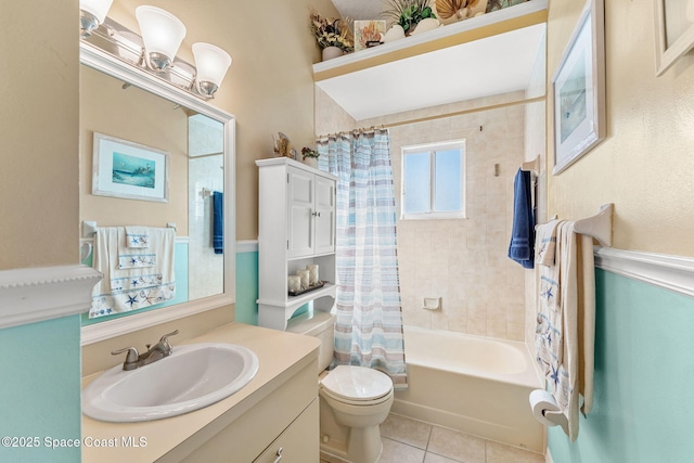 full bathroom featuring tile patterned flooring, vanity, toilet, and shower / bathtub combination with curtain