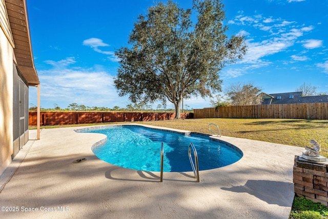 view of swimming pool featuring a yard and a patio