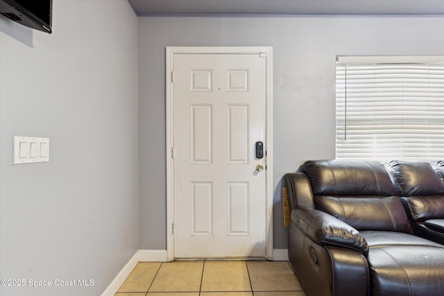 foyer with light tile patterned floors