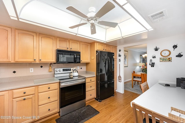 kitchen with black appliances, ceiling fan, light brown cabinets, light hardwood / wood-style flooring, and backsplash