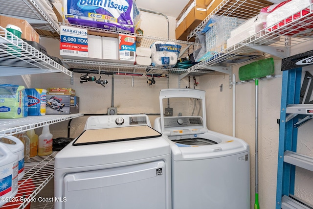 laundry room with washer and clothes dryer