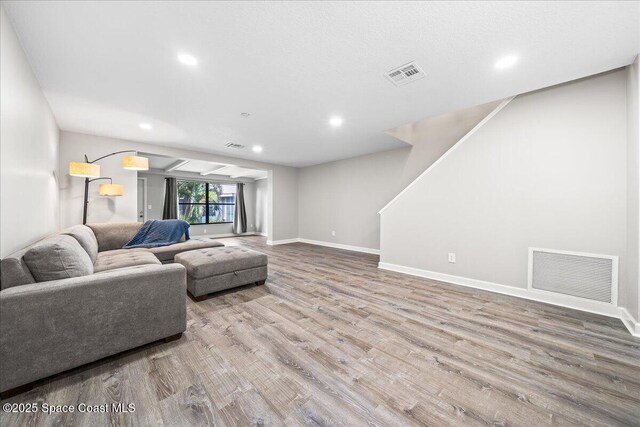 living room with light hardwood / wood-style flooring