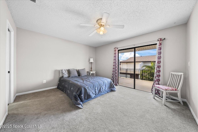 carpeted bedroom with access to outside, ceiling fan, and a textured ceiling