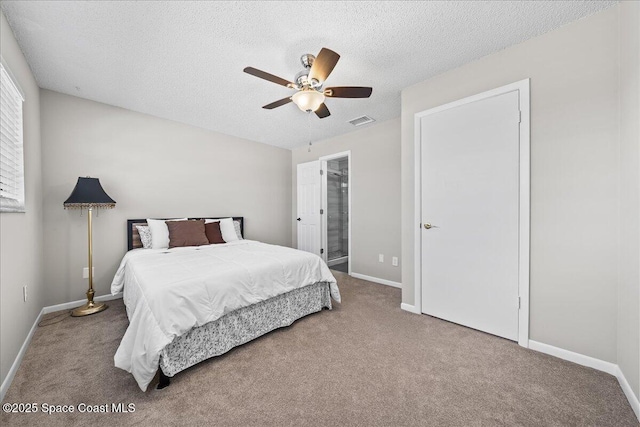 bedroom featuring carpet flooring, ceiling fan, and a textured ceiling