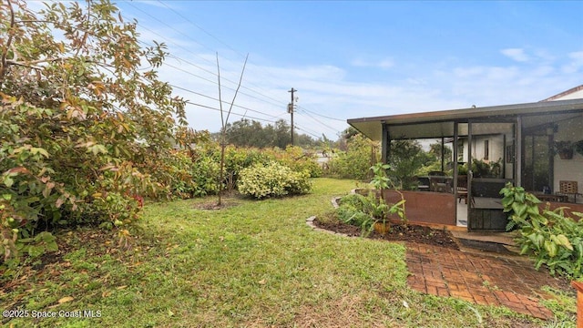 view of yard featuring a sunroom