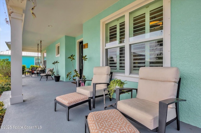 view of patio featuring a porch