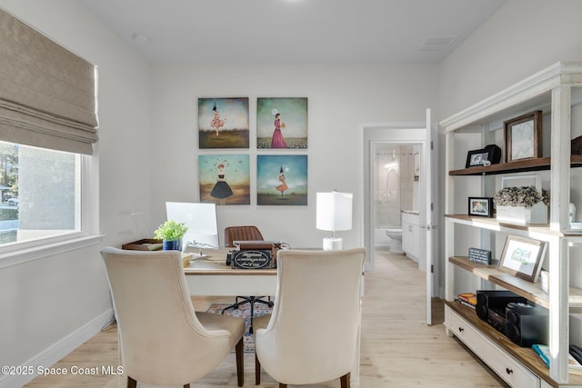 office area with light hardwood / wood-style flooring