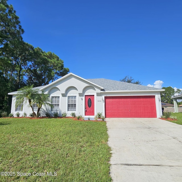 ranch-style home featuring a garage and a front lawn