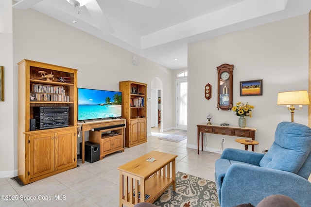 living room featuring ceiling fan and light tile patterned floors