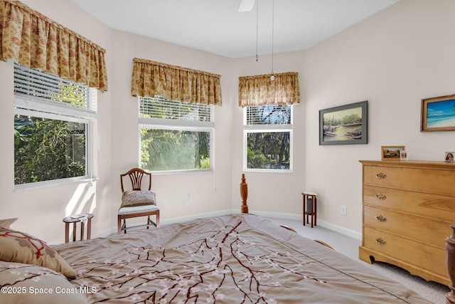 bedroom featuring light colored carpet and ceiling fan